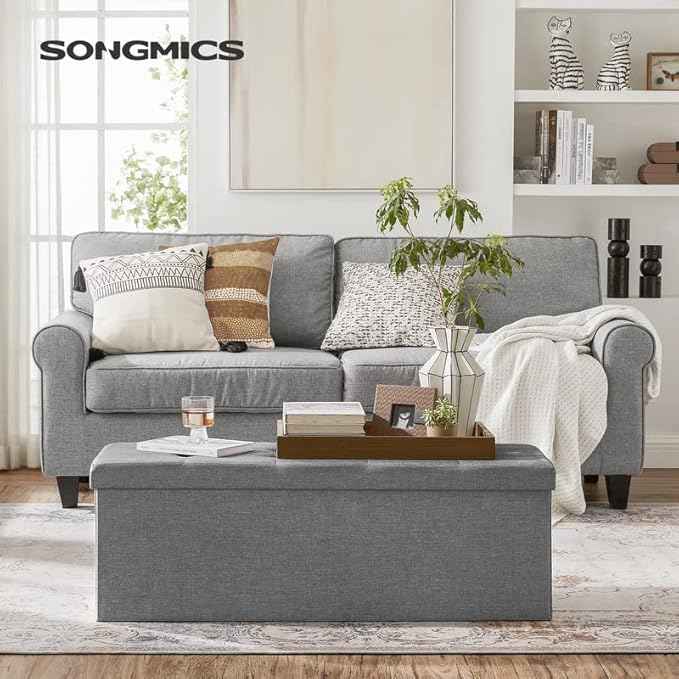 SONGMICS MAZIE Collection - 43 Inches Folding Storage Ottoman Bench, Ottoman Foot Rest, End of Bed Bench, Storage Chest, Load 660 lb, for Living Room, Bedroom, Entryway, Light Gray ULSF77G
